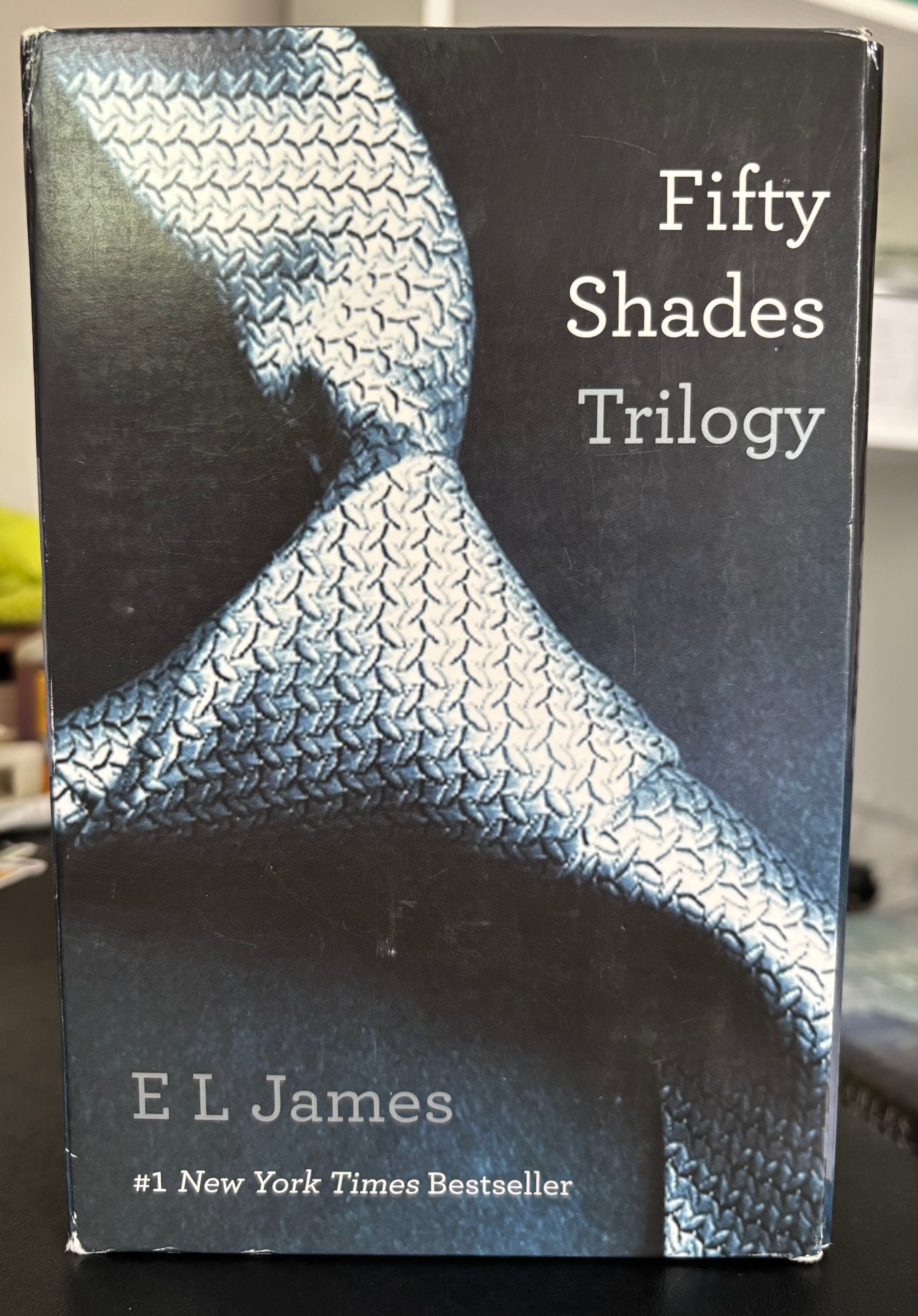 Fifty Shades Trilogy (Fifty Shades of Grey, Fifty Shades Darker, Fifty Shades Freed) by E.L. James paperback (rescued)