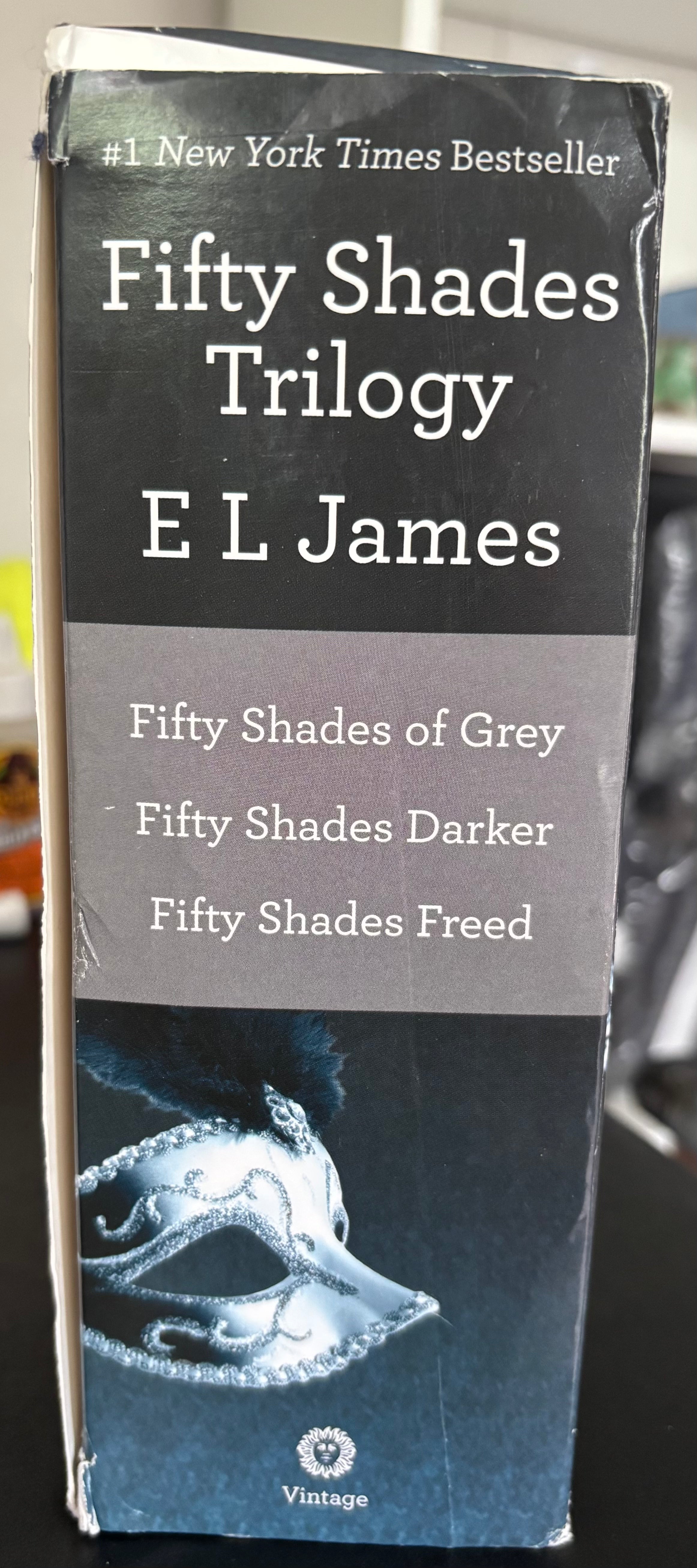 Fifty Shades Trilogy (Fifty Shades of Grey, Fifty Shades Darker, Fifty Shades Freed) by E.L. James paperback (rescued)