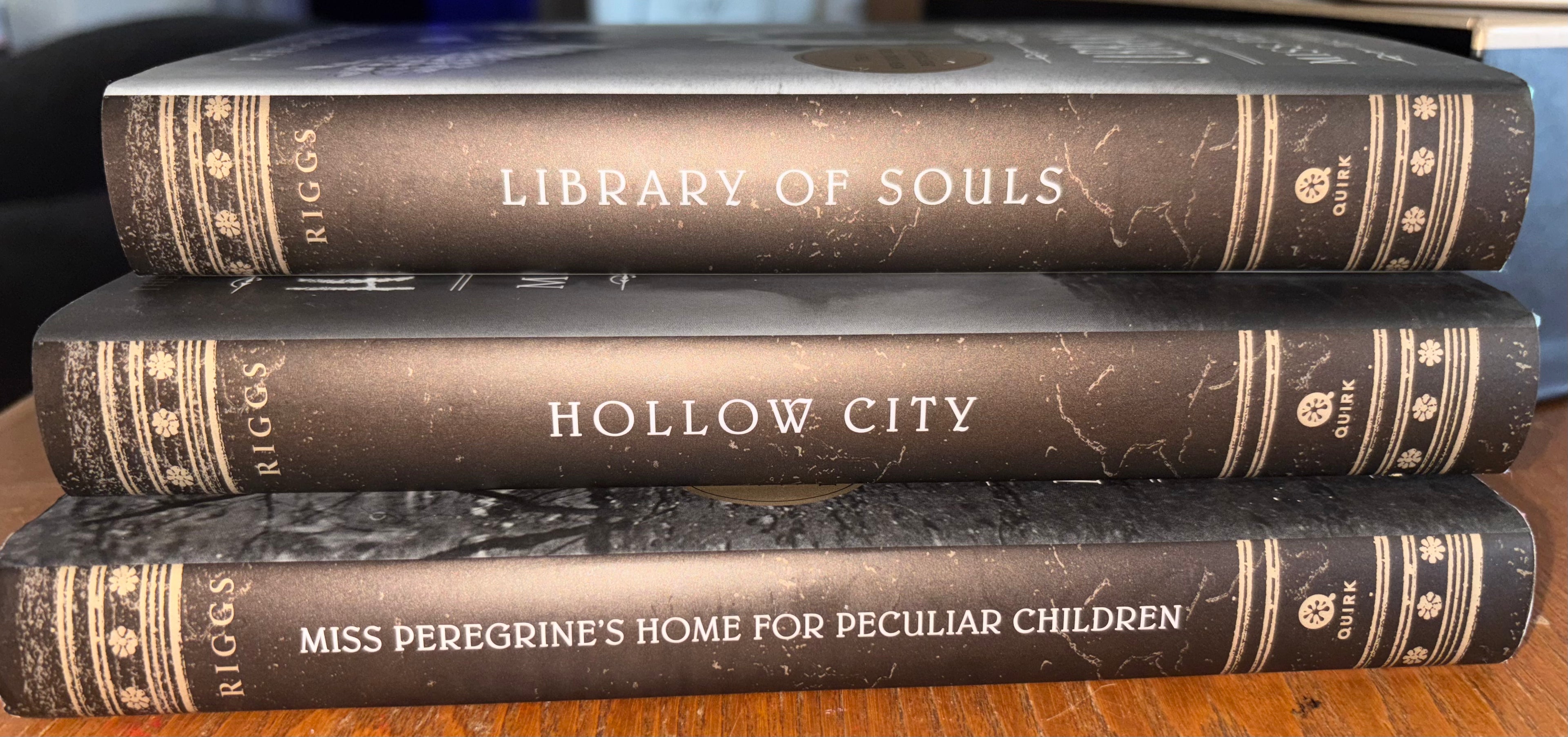 3 book box set, Miss Peregrine's Home for Peculiar Children, Hollow Ciity, and Library of Souls by Ransom Riggs (the first 3 books of Miss Peregrine‘s Peculiar Children series) plus additional pictures hardcover YA (like new)