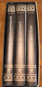 3 book box set, Miss Peregrine's Home for Peculiar Children, Hollow Ciity, and Library of Souls by Ransom Riggs (the first 3 books of Miss Peregrine‘s Peculiar Children series) plus additional pictures hardcover YA (like new)