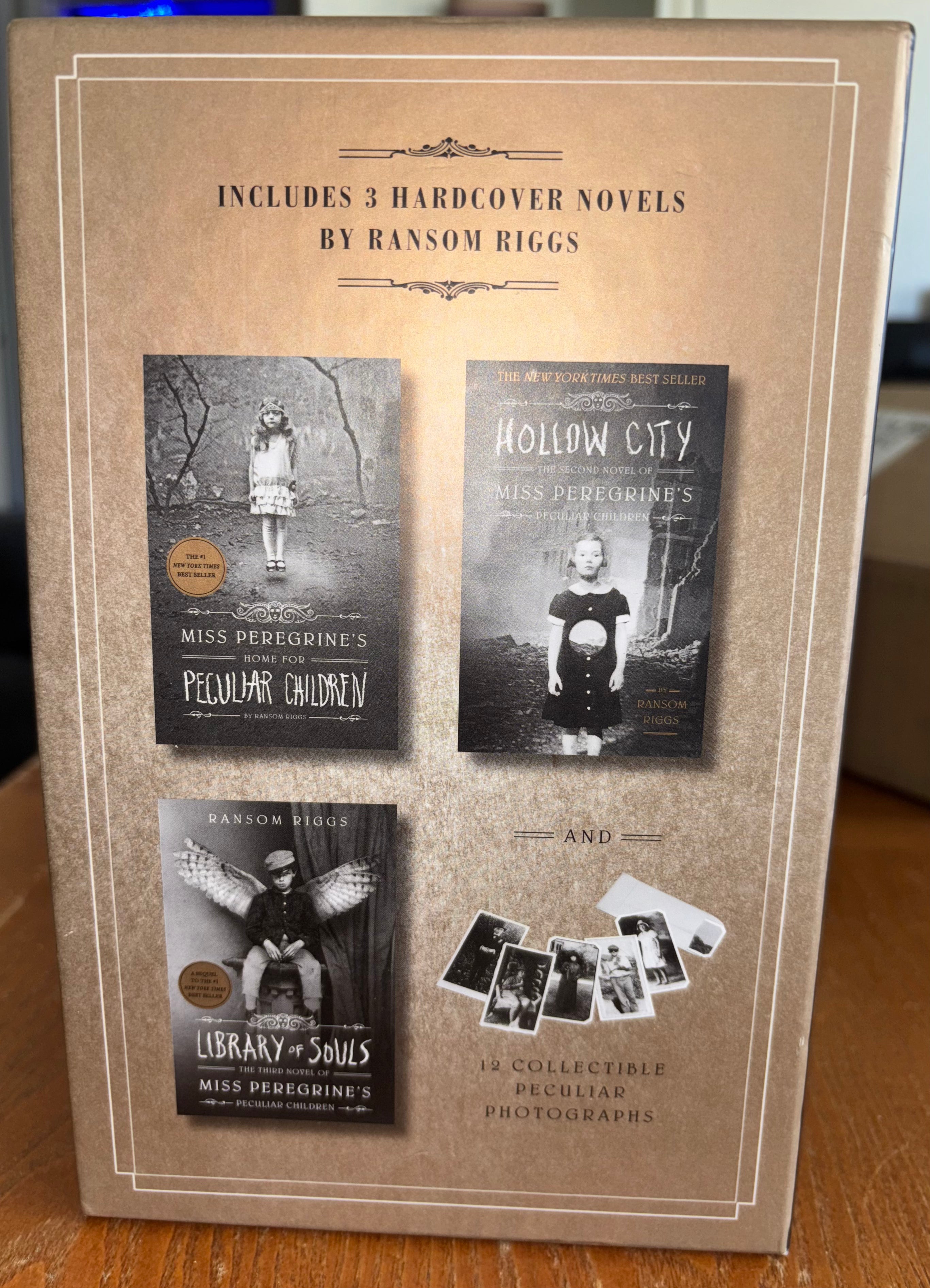 3 book box set, Miss Peregrine's Home for Peculiar Children, Hollow Ciity, and Library of Souls by Ransom Riggs (the first 3 books of Miss Peregrine‘s Peculiar Children series) plus additional pictures hardcover YA (like new)
